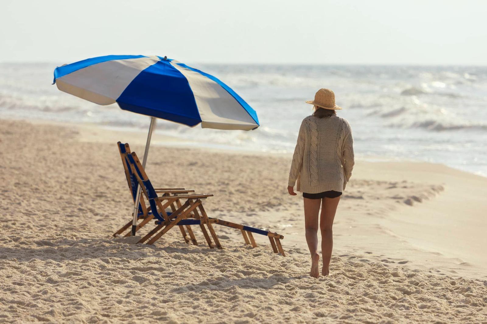Girl walking to beach chair on Perdido Key Beach
